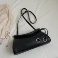 Black litchi grain textured handbag with wavy rim and golden ring buckle detail - Black