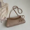 Terracotta textured faux leather crossbody bag with distinctive wave-edge closure - Khaki