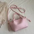 Minimalist light pink PU leather tote bag with drawstring detail and adjustable strap - Pink