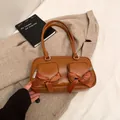 Retro brown faux leather shoulder bag with decorative bows and double zip pockets - Brown