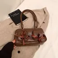 Retro brown PU leather underarm bag with double front pockets and silk bow accent - Brown