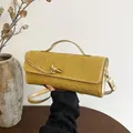 Borsa a spalla dorata con strass scintillanti e fibbia metallica con nodo lucido - Oro
