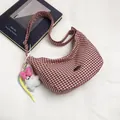 Red gingham hobo shoulder bag with a cute white bunny plush charm and metal logo - Red