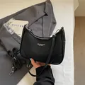 Premium black pebbled leather underarm hobo bag featuring a detachable shoulder strap - Black
