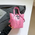Pink punk style bucket bag featuring metallic cross pendant and dark metal rivets - Pink