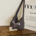 Dark grey large nylon crossbody bag with December print on a wooden surface - Dark Gray