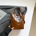 Brown punk bucket bag with silver studs and gothic cross pendant on smooth faux leather - Brown