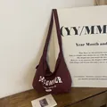 Burgundy nylon tote bag with white December 1996 text print and adjustable strap - Burgundy
