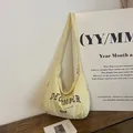 Light yellow nylon messenger bag with December 1996 vintage print and wide strap - Off White