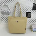 Minimalist canvas tote bag in khaki yellow with a front zipper pocket for daily commute - Khaki
