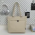 Minimalist cream canvas tote bag with front zipper pocket and long shoulder straps - Off White
