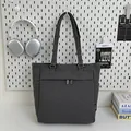 Dark grey canvas tote bag with side pockets and zippers for daily work and commuting - Gray