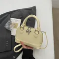 Cream shell crossbody bag in smooth leather with silver heart and key charm accents - Yellow