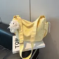 Pale yellow tote bag with silver star prints and plush sheep pendant detail - Yellow with Pendant