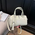 Creamy yellow glossy Boston bag in Korean style with silver hardware and shoulder strap - No Pendant / Yellow