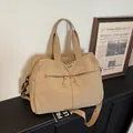 Khaki canvas travel duffel bag with red contrast stitching and large capacity - Khaki