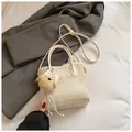 Creamy beige crossbody bag with a cute plush bear charm and adjustable shoulder strap - With Charm / White