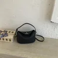 Chic black lychee leather crossbody bag with silver lock and top handle for women - No Pendant / Black