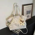 Cream white vintage tote bag with plush bear charm and adjustable shoulder straps - Cream White with Pendant