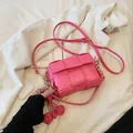 Pink woven PU leather crossbody bag with adjustable strap and decorative ball charm - With Pendant / Rose Pink