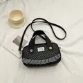Black polka dot crossbody bag with lace trim and cute floral accents on white fabric - Black