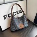 Blue denim monogram tote bag with brown leather M logo patch and silver chain strap - Blue