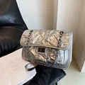 Chic silver metallic quilted crossbody bag with black chain strap and turn-lock closure - Silver Large