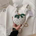 Cute strawberry-shaped crossbody bag in pearl white with gold studs and chain strap - White