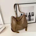 Chic tan brown leather hobo shoulder bag with adjustable strap for daily commute use - Tan