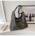 Detailed view of large grey tote bag with leather straps on a white pedestal - No Pendant / Black
