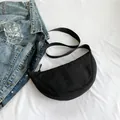 Minimalist black nylon half-moon crossbody bag with adjustable wide shoulder strap - Black