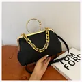 Chic black jacquard crossbody bag with gold ring handles and chunky chain strap - Black