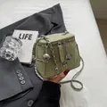 Mini light green bucket bag with chain strap and camellia charm in wrinkled leather - Green