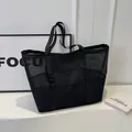 Bolso tote de malla negra minimalista con bolsillos frontales para gimnasio o viaje - Negro