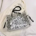 Transparent PVC graffiti tote bag with black street art sketches and slim shoulder straps - Black