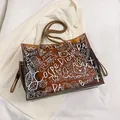 Stylish brown large capacity graffiti transparent jelly tote bag for summer fashion - Brown