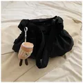 Black canvas drawstring bucket bag with adjustable strap and cute plush charm pendant - With Pendant / Black
