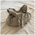 Minimalist khaki drawstring bucket bag with adjustable strap and textured nylon fabric - No Pendant / Off White