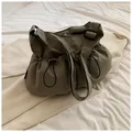 Olive green drawstring nylon crossbody bucket bag with adjustable black shoulder strap - No Pendant / Green