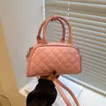 Pink quilted mini Boston bag with adjustable shoulder strap and dual top handles - Pink