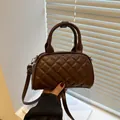 Quilted dark brown boston bag for women with dual top handles and adjustable strap - Brown