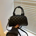 Mini black quilted Boston bag with top handles and adjustable shoulder strap for women - Black
