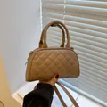 Brown quilted Boston handbag with adjustable crossbody strap and top handle - Khaki