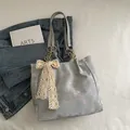 Minimalist grey large capacity tote bag with pink AIMITU STUDIO print and lace bow - Blue