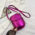 Metallic magenta saddle crossbody bag with adjustable strap and embossed text - Rose Red