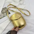 Mini metallic gold saddle bag with front flap and embossed fashion lettering - Gold