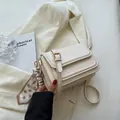 Macro shot of cream white leather crossbody bag with decorative polka dot silk scarf detail - No Pendant / Off White