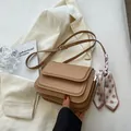 Detail of khaki flap crossbody bag with decorative polka dot scarf and golden logo - No Pendant / Khaki