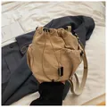 Khaki drawstring nylon bucket bag with side mesh pocket and adjustable shoulder strap - Khaki