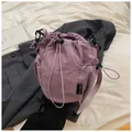 Purple nylon drawstring bucket bag with mesh side pockets and adjustable shoulder strap - Purple